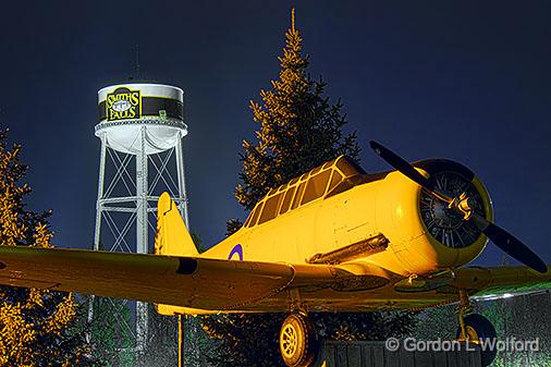 Yellow Peril Harvard_34638-45.jpg - The North American Harvard aircraft joined the RCAF (Royal Canadian Air Force) in 1940and for a quarter of a century, was the RCAF's most famous advanced trainer. The"Yellow Peril" was a common sight over the prairies of Canada. The two-place, singleengine propellor-driven Aircraft was eventually replaced by the "Tutor" jet trainer.This 'Yellow Peril' is mounted on a pedestal in Victoria Park, along the Rideau Canal in Smiths Falls.Photographed at Smiths Falls, Ontario, Canada.